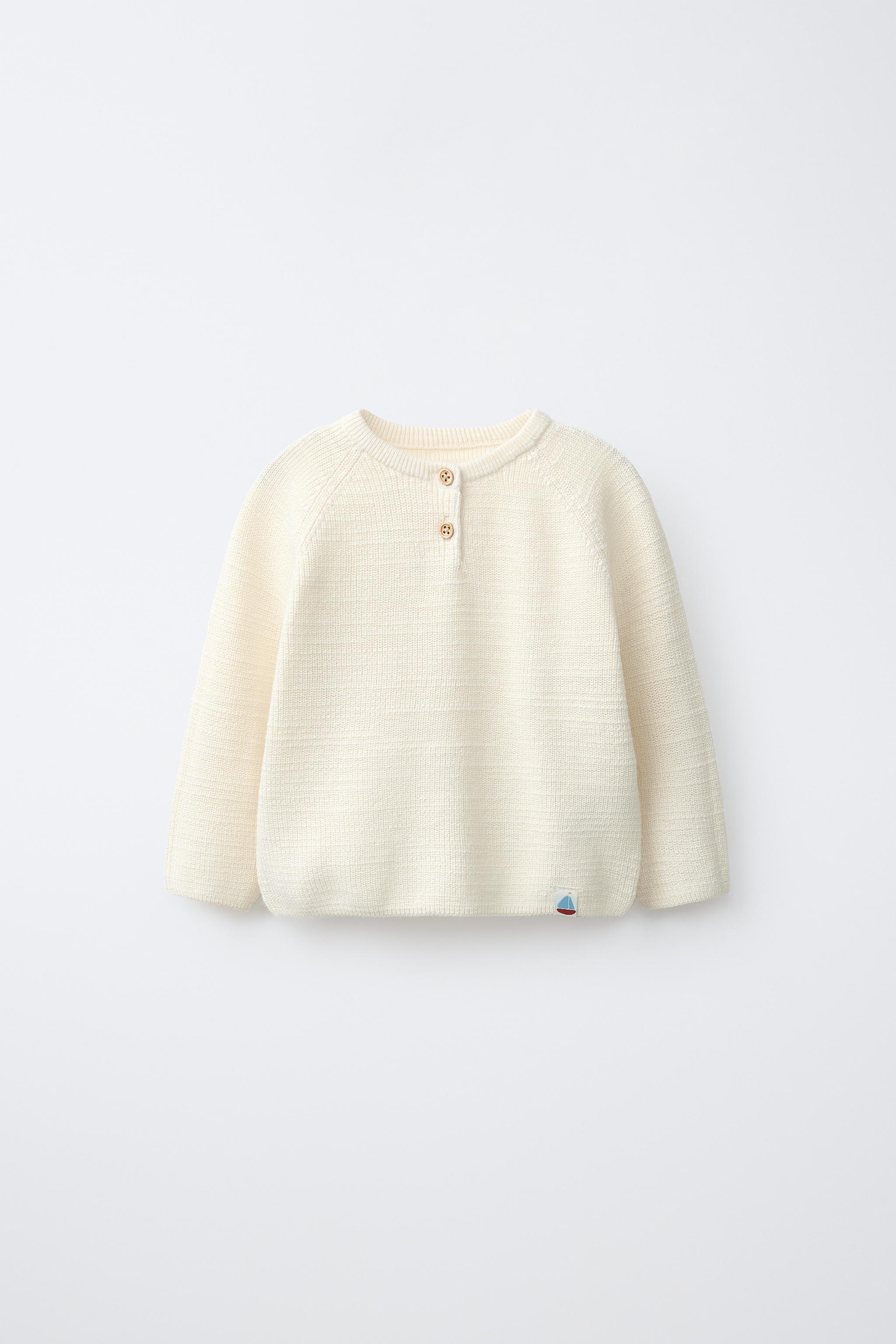 PULL EN MAILLE PERLÉE AVEC ÉTIQUETTE